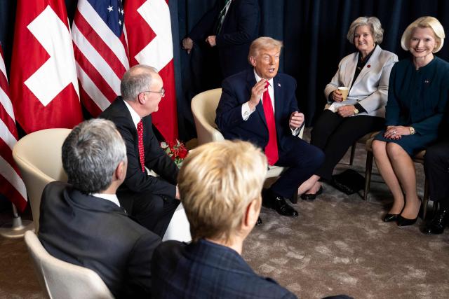 US President Donald Trump (3R) speaks during for a bilateral meeting with Switzerland's President Guy Parmelin (3L) on the sidelines of the World Economic Forum (WEF) annual meeting in Davos on January 21, 2026. The World Economic Forum is taking place in Davos from January 19 to January 23, 2026. (Photo by LAURENT GILLIERON / POOL / AFP)