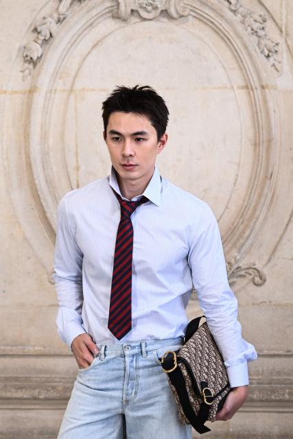 Dongsheng Li  poses for a photocall ahead of the Dior Menswear Ready-to-wear Fall-Winter 2026/2027 collection as part of the Men Paris Fashion Week in Paris on January 21, 2026.  (Photo by Blanca CRUZ / AFP)