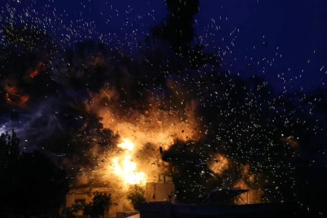 Smoke and sparks ascend from the site of an Israeli airstrike that targeted a building in the southern Lebanese village of Al-Kfour on January 21, 2026. Israel has kept up regular strikes in Lebanon despite the November 2024 truce that sought to end more than a year of hostilities with Hezbollah, usually saying it is targeting members of the Iran-backed group or its infrastructure. (Photo by Rabih DAHER / AFP)