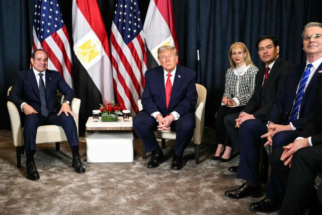 US President Donald Trump (C) speaks with Egypt's President Abdel Fattah al-Sissi (L) next to US Secretary of State Marco Rubio (2R) and US Secretary of Treasury Scott Bessent during a bilateral meeting on the sidelines of the World Economic Forum (WEF) annual meeting in Davos on January 21, 2026. The World Economic Forum takes place in Davos from January 19 to January 23, 2026. (Photo by Mandel NGAN / AFP)