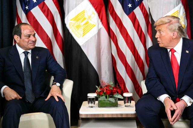 US President Donald Trump (R) speaks with Egypt's President Abdel Fattah al-Sissi during a bilateral meeting on the sidelines of the World Economic Forum (WEF) annual meeting in Davos on January 21, 2026. The World Economic Forum takes place in Davos from January 19 to January 23, 2026. (Photo by Mandel NGAN / AFP)