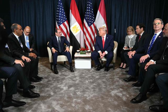 US President Donald Trump (C-R) speaks with Egypt's President Abdel Fattah al-Sissi next to US Secretary of State Marco Rubio (3R), US Secretary of Treasury Scott Bessent (2R) and US Secretary of Commerce Howard Lutnick (R) during a bilateral meeting on the sidelines of the World Economic Forum (WEF) annual meeting in Davos on January 21, 2026. The World Economic Forum takes place in Davos from January 19 to January 23, 2026. (Photo by Mandel NGAN / AFP)
