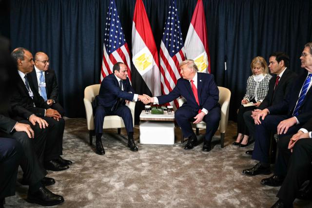 US President Donald Trump attends a bilateral meeting with Egypt's President Abdel Fattah al-Sissi next to US Secretary of State Marco Rubio (3R) and US Secretary of Treasury Scott Bessent (R) on the sidelines of the World Economic Forum (WEF) annual meeting in Davos on January 21, 2026. The World Economic Forum takes place in Davos from January 19 to January 23, 2026. (Photo by Mandel NGAN / AFP)