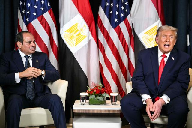 US President Donald Trump (R) speaks with Egypt's President Abdel Fattah al-Sissi during a bilateral meeting on the sidelines of the World Economic Forum (WEF) annual meeting in Davos on January 21, 2026. The World Economic Forum takes place in Davos from January 19 to January 23, 2026. (Photo by Mandel NGAN / AFP)