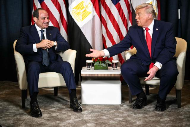 US President Donald Trump (R) speaks with Egypt's President Abdel Fattah al-Sissi during a bilateral meeting on the sidelines of the World Economic Forum (WEF) annual meeting in Davos on January 21, 2026. The World Economic Forum takes place in Davos from January 19 to January 23, 2026. (Photo by Mandel NGAN / AFP)