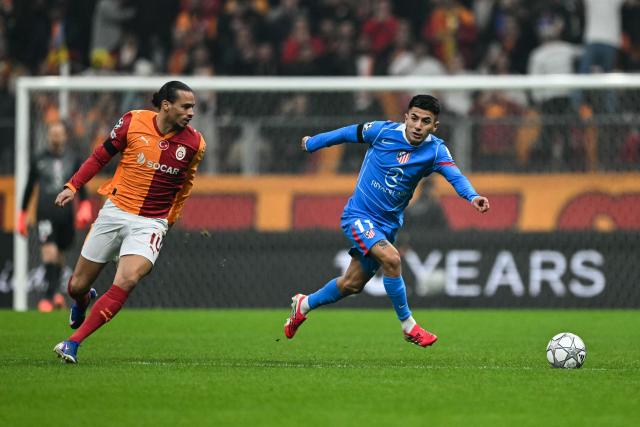 Galatasaray's German midfielder #10 Leroy Sane (L) fights for the ball with Atletico Madrid's Argentine midfielder #11 Thiago Almada during the UEFA Champions League, league phase day 7, football match between Galatasaray and Atletico Madrid at Rams Park in Istanbul, on January 21, 2026. (Photo by OZAN KOSE / AFP)