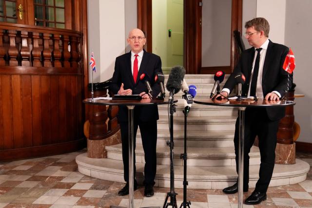 Denmark's Defense Minister Troels Lund Poulsen and the Britain's Defence Secretary John Healey (L) meet the press at a doorstep at the Ministry of Defense in Copenhagen, Denmark, January 21, 2026. (Photo by Thomas Traasdahl / Ritzau Scanpix / AFP) / Denmark OUT