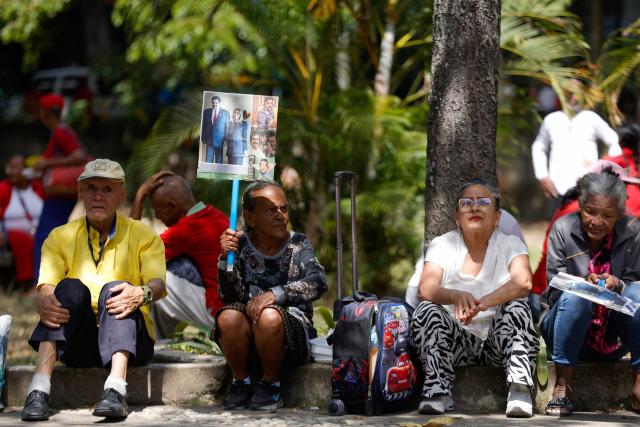 People take part in a demonstration by elder people to demand the release of ousted Venezuelan President Nicolas Maduro and his wife Cilia Flores in Caracas on January 21, 2026. (Photo by Pedro MATTEY / AFP)