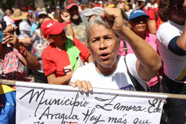 A man takes part in a demonstration by elder people to demand the release of ousted Venezuelan President Nicolas Maduro and his wife Cilia Flores in Caracas on January 21, 2026. (Photo by Pedro MATTEY / AFP)