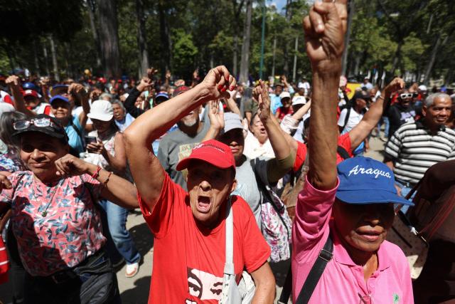 People take part in a demonstration by elder people to demand the release of ousted Venezuelan President Nicolas Maduro and his wife Cilia Flores in Caracas on January 21, 2026. (Photo by Pedro MATTEY / AFP)