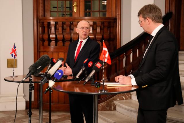 Denmark's Defense Minister Troels Lund Poulsen and the Britain's Defence Secretary John Healey (L) meet the press at a doorstep at the Ministry of Defense in Copenhagen, Denmark, January 21, 2026. (Photo by Thomas Traasdahl / Ritzau Scanpix / AFP) / Denmark OUT