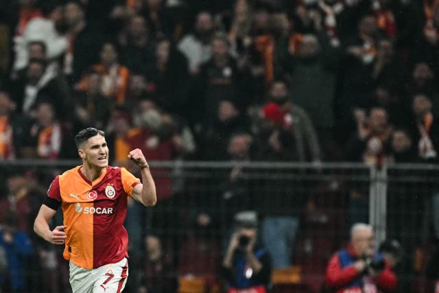Galatasaray's Hungarian forward #07 Roland Sallai celebrates after his team first goal following the own goal scored by Atletico Madrid's Spanish midfielder #14 Marcos Llorente during the UEFA Champions League, league phase day 7, football match between Galatasaray and Atletico Madrid at Rams Park in Istanbul, on January 21, 2026. (Photo by OZAN KOSE / AFP)