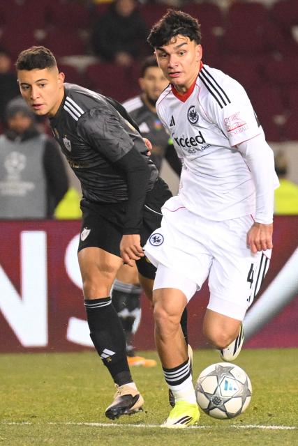 Qarabag's Brazilian midfielder Pedro Bicalho and Frankfurt's Turkish forward #42 Can Uzun vie for the ball during the UEFA Champions League league phase football match between Qarabag and Frankfurt at the Tofiq Bahramov Republican Stadium in Baku on January 21, 2026. (Photo by Tofik BABAYEV / AFP)