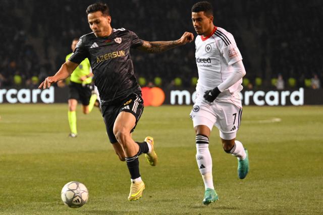 Qarabag's Brazilian defender #02 Matheus de Barros da Silva and Frankfurt's German forward #07 Ansgar Knauff vie for the ball during the UEFA Champions League league phase football match between Qarabag and Frankfurt at the Tofiq Bahramov Republican Stadium in Baku on January 21, 2026. (Photo by Tofik BABAYEV / AFP)