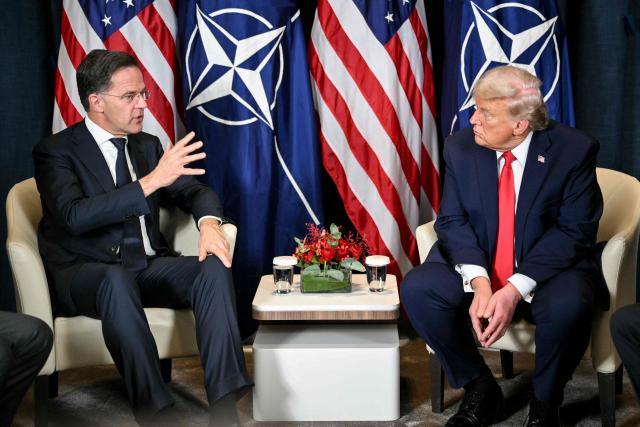 US President Donald Trump (R) speaks with NATO’s Secretary-General Mark Rutte during a bilateral meeting on the sidelines of the World Economic Forum (WEF) annual meeting in Davos on January 21, 2026. The World Economic Forum takes place in Davos from January 19 to January 23, 2026. (Photo by Mandel NGAN / AFP)