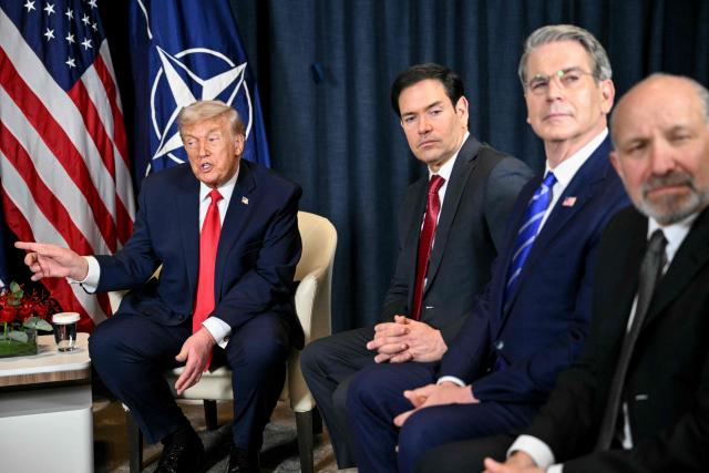 US President Donald Trump (L) speaks with NATO’s Secretary-General next to US Secretary of State Marco Rubio (3R), US Secretary of Treasury Scott Bessent (2R) and US Secretary of Commerce Howard Lutnick during a bilateral meeting on the sidelines of the World Economic Forum (WEF) annual meeting in Davos on January 21, 2026. The World Economic Forum takes place in Davos from January 19 to January 23, 2026. (Photo by Mandel NGAN / AFP)