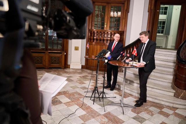 Denmark's Defense Minister Troels Lund Poulsen and the Britain's Defence Secretary John Healey (L) meet the press at a doorstep at the Ministry of Defense in Copenhagen, Denmark, January 21, 2026. (Photo by Thomas Traasdahl / Ritzau Scanpix / AFP) / Denmark OUT