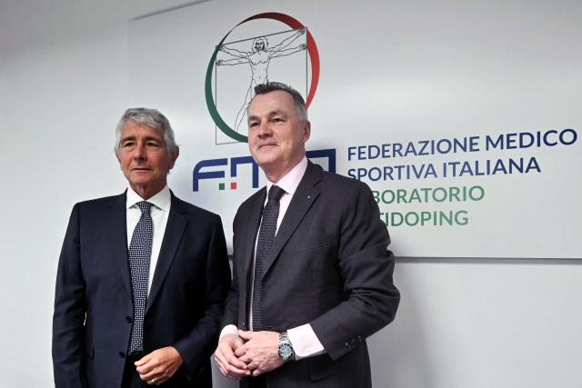 WADA (World Antidoping Agency) Senior Director Olivier Rabin (R) and Italy's Sport Minister Andrea Abodi pose prior a press conference at the FMSI (Italian Sports Medicine Federation) headquarters and antidoping laboratories in Rome on January 21, 2026. The facility, one of 30 worldwide accredited by the WADA (World Antidoping Agency), is located on the outskirts of the capital, making Italy a point of reference not only for the upcoming Olympic and Paralympic Games Milano Cortina 2026, but also for the international sports system. (Photo by Filippo MONTEFORTE / AFP)