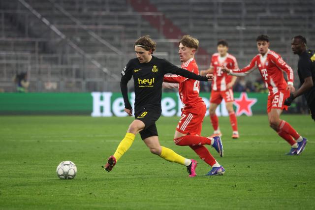 Union St-Gilloise's Belgian midfielder #06 Kamiel Van De Perre (L) and Bayern Munich's German midfielder #42 Lennart Karl (2nd L) vie for the ball during the UEFA Champions League football match between FC Bayern Munich (GER) and Royale Union St-Gilloise (BEL) in Munich, southern Germany, on January 21, 2026. (Photo by Karl-Josef HILDENBRAND / AFP)