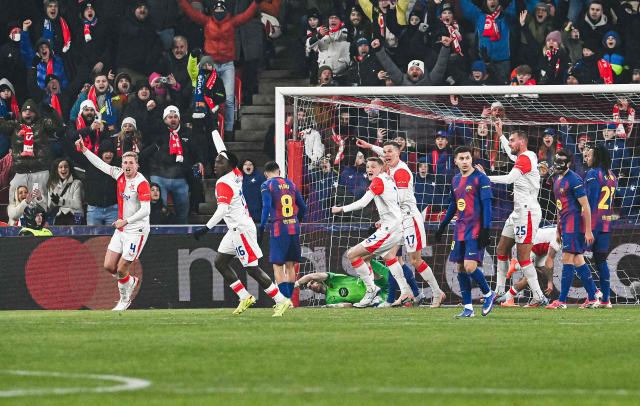 Prague's team celebrates the 1-0 scored by Slavia Prague's Czech forward #09 Vasil Kusej (unseen) during in the UEFA Champions League football match between Slavia Prague (CZE) and FC Barcelona (ESP) in Prague, Czech Republic on January  21, 2026. (Photo by Michal Cizek / AFP)