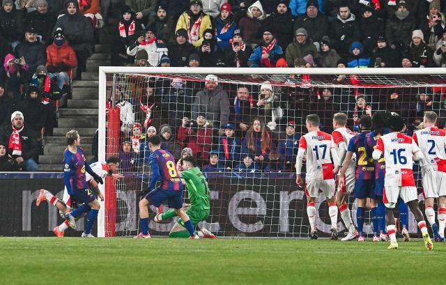 Slavia Prague's Czech forward #09 Vasil Kusej (2nd L) scores the 1-0 during in the UEFA Champions League football match between Slavia Prague (CZE) and FC Barcelona (ESP) in Prague, Czech Republic on January  21, 2026. (Photo by Michal Cizek / AFP)