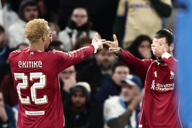 Liverpool's French forward #22 Hugo Ekitike (L) celebrates scoring his team's first goal during the UEFA Champions League, league phase day 7, football match between Olympique de Marseille (OM) and Liverpool FC at the Stade Velodrome in Marseille, southern France, on January 21, 2026. (Photo by Thibaud MORITZ / AFP)