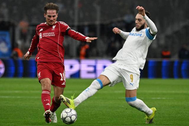 Liverpool's Argentine midfielder #10 Alexis Mac Allister (L) fights for the ball with Marseille's Algerian forward #09 Amine Gouiri (R) during the UEFA Champions League, league phase day 7, football match between Olympique de Marseille (OM) and Liverpool FC at the Stade Velodrome in Marseille, southern France, on January 21, 2026. (Photo by Miguel MEDINA / AFP)