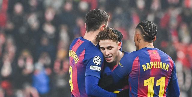Barcelona's Spanish midfielder #16 Fermin Lopez (C) celebrates with team mates after scoring during in the UEFA Champions League football match between Slavia Prague (CZE) and FC Barcelona (ESP) in Prague, Czech Republic on January  21, 2026. (Photo by Michal Cizek / AFP)