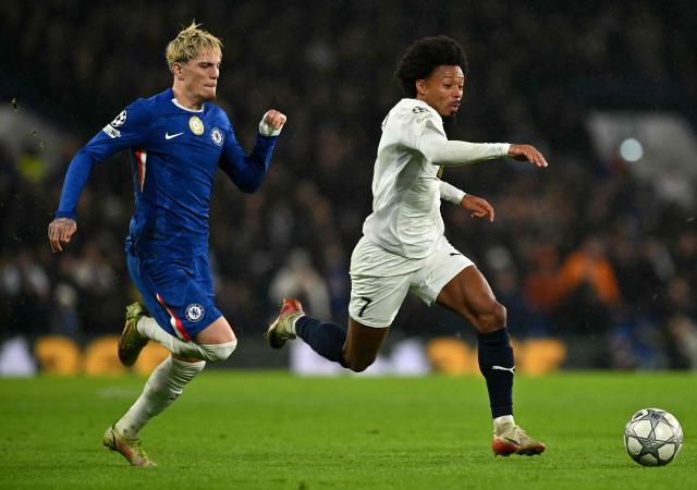 Pafos FC's Brazilian midfielder #07 Bruno Felipe runs with the ball whilst under pressure from Chelsea's Argentinian midfielder #49 Alejandro Garnacho during the UEFA Champions League league-phase football match between Chelsea and Pafos at Stamford Bridge in London on January 21, 2026. (Photo by Glyn KIRK / AFP)