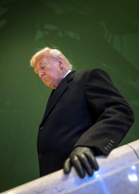 US President Donald Trump leaves the congress centre during the World Economic Forum (WEF) annual meeting in Davos on January 21, 2026. The World Economic Forum takes place in Davos from January 19 to January 23, 2026. (Photo by Fabrice COFFRINI / AFP)