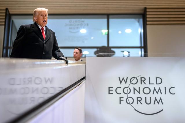 US President Donald Trump reacts as he leaves the congress centre during the World Economic Forum (WEF) annual meeting in Davos on January 21, 2026. The World Economic Forum takes place in Davos from January 19 to January 23, 2026. (Photo by Fabrice COFFRINI / AFP)
