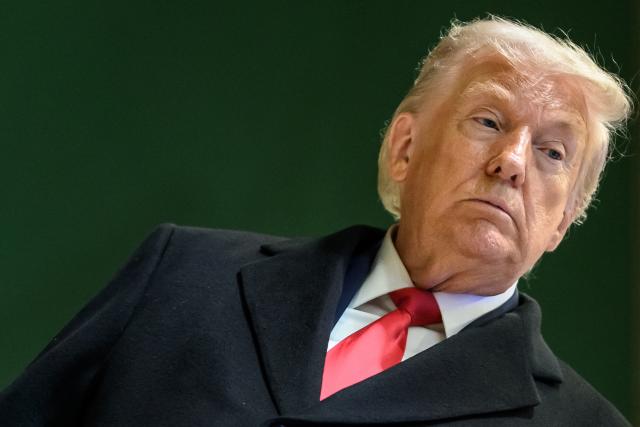 US President Donald Trump looks on as he leaves the congress centre during the World Economic Forum (WEF) annual meeting in Davos on January 21, 2026. The World Economic Forum takes place in Davos from January 19 to January 23, 2026. (Photo by Fabrice COFFRINI / AFP)