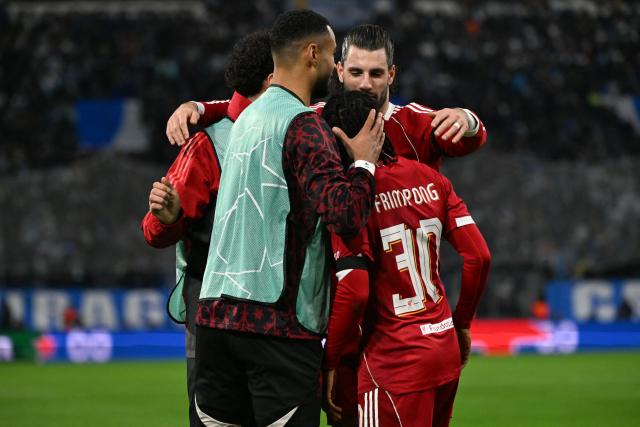 Liverpool players celebrate the 2-0 goal during the UEFA Champions League, league phase day 7, football match between Olympique de Marseille (OM) and Liverpool FC at the Stade Velodrome in Marseille, southern France, on January 21, 2026. (Photo by Miguel MEDINA / AFP)