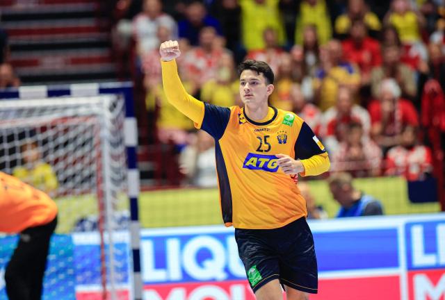Sweden's left back #25 Nikola Roganovic celebrates during the men's EHF Euro 2026 Group E preliminary round handball match between Sweden and Croatia in Malmo, Sweden, on January 21, 2026. (Photo by Andreas Hillergren/TT / TT News Agency / AFP) / Sweden OUT