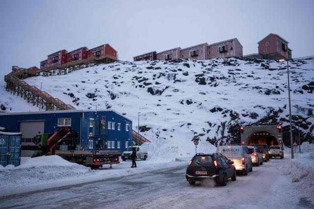 Cars queue to pass through the Sullorsuaq tunnel beneath hillside homes in Nuuk, Greenland, on January 21, 2026. (Photo by Jonathan NACKSTRAND / AFP)