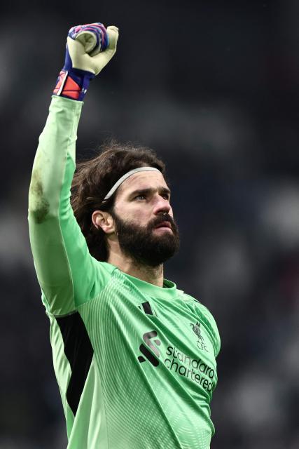 Liverpool's Brazilian goalkeeper #01 Alisson celebrates at the end of the UEFA Champions League, league phase day 7, football match between Olympique de Marseille (OM) and Liverpool FC at the Stade Velodrome in Marseille, southern France, on January 21, 2026. (Photo by Thibaud MORITZ / AFP)