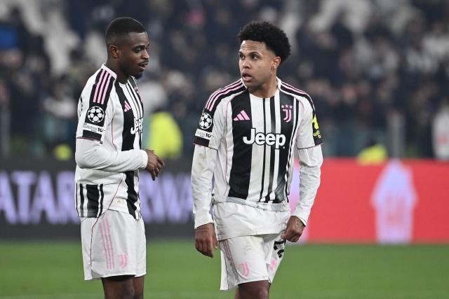 Juventus' French defender #15 Pierre Kalulu Kyatengwa and Juventus' US midfielder #22 Weston McKennie celebrate after winning the UEFA Champions League - league phase day 7 football match between Juventus and Benfica at the Allianz stadium in Turin, on January 21, 2026. (Photo by Isabella BONOTTO / AFP)