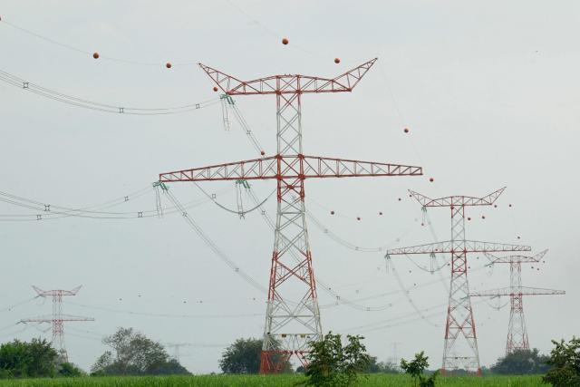 A view of electrical transmision lines in Yumbo, near Cali, Colombia taken on January 21, 2026. Ecuador's President Daniel Noboa on January 21, 2026, announced 30-percent tariffs on imports from Colombia, accusing its neighbor of failing to help fight drug cartels. Colombia mainly exports electricity, medicines, vehicles, cosmetics, and plastics to Ecuador, according to Colombia's National Foreign Trade Association (Analdex). (Photo by Joaquín SARMIENTO / AFP)