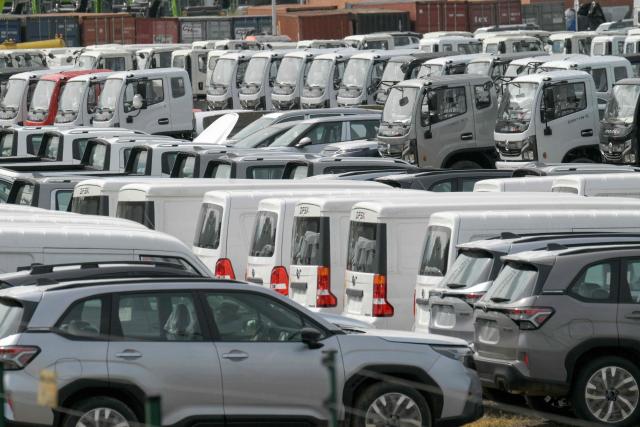 New cars and trucks are parked at a free trade zone in Yumbo, near Cali, Colombia on January 21, 2026. Ecuador's President Daniel Noboa on January 21, 2026, announced 30-percent tariffs on imports from Colombia, accusing its neighbor of failing to help fight drug cartels. Colombia mainly exports electricity, medicines, vehicles, cosmetics, and plastics to Ecuador, according to Colombia's National Foreign Trade Association (Analdex). (Photo by Joaquín SARMIENTO / AFP)