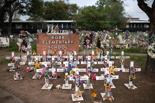 (FILES) Crosses set up to honor those who lost their lives during the Robb Elementary School shooting are seen in Uvalde, Texas on November 8, 2022. A US jury on January 21, 2026 acquitted the former school police officer for his response to a 2022 mass shooting at a Texas elementary school which killed 21 people, including 19 children -- the the frustration of the victims's families. (Photo by Mark Felix / AFP)