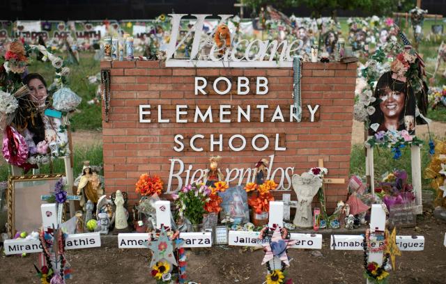 (FILES) Crosses set up to honor those who lost their lives during the Robb Elementary School shooting are seen in Uvalde, Texas on November 8, 2022. A US jury on January 21, 2026 acquitted the former school police officer for his response to a 2022 mass shooting at a Texas elementary school which killed 21 people, including 19 children -- the the frustration of the victims's families. (Photo by Mark Felix / AFP)