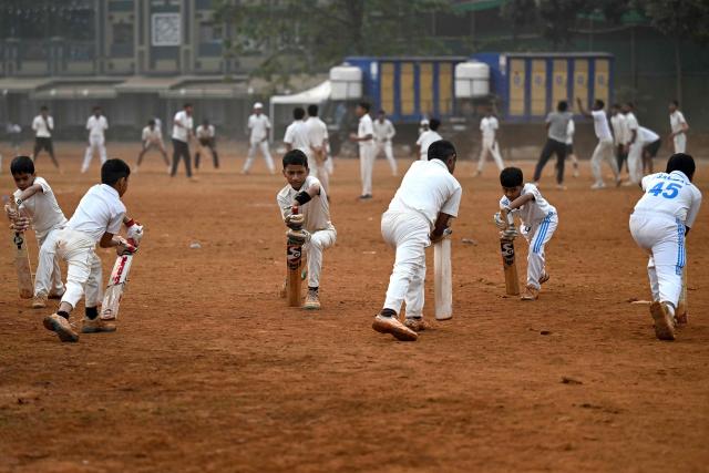 Young cricketers take part in a batting practice session at Shivaji Park, a popular public ground in Mumbai on January 22, 2026. Cricket's governing body said January 21, it had rejected Bangladesh's request to shift their T20 World Cup matches out of India, casting doubt on their participation in next month's tournament. (Photo by Punit PARANJPE / AFP)