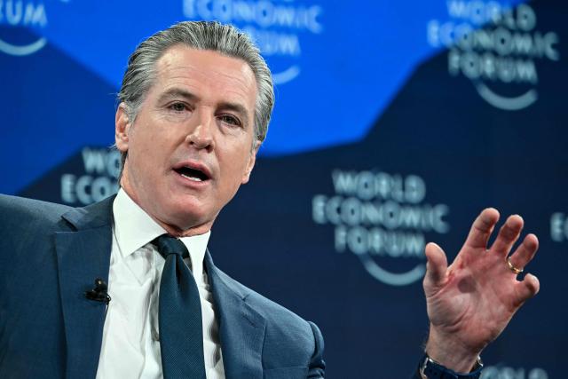 US Governor Of california Gavin Newsom gestures as he speaks during the World Economic Forum (WEF) annual meeting in Davos on January 22, 2026. The World Economic Forum takes place in Davos from January 19 to January 23, 2026. (Photo by Fabrice COFFRINI / AFP)