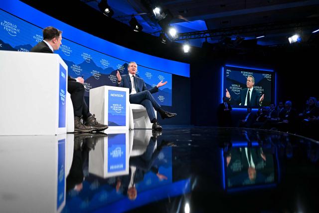 US Governor Of california Gavin Newsom (C) gestures as he speaks during the World Economic Forum (WEF) annual meeting in Davos on January 22, 2026. The World Economic Forum takes place in Davos from January 19 to January 23, 2026. (Photo by Fabrice COFFRINI / AFP)