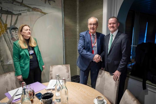 Switzerland's President Guy Parmelin (L) shakes hands with US Trade Representative Jamieson Greer during a bilateral meeting on the sidelines of the World Economic Forum (WEF) annual meeting in Davos on January 22, 2026. The World Economic Forum takes place in Davos from January 19 to January 23, 2026. (Photo by LAURENT GILLIERON / POOL / AFP)
