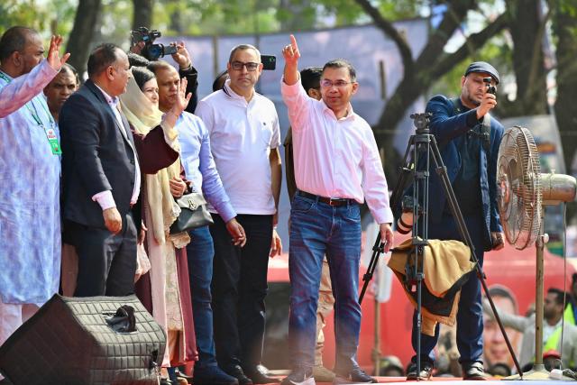 Bangladesh Nationalist Party (BNP) chairman Tarique Rahman (3R) waves to supporters during a rally as he begins campaigning ahead of the upcoming national election, in Sylhet on January 22, 2026. Bangladesh begins official campaigning on January 22 for hugely anticipated general elections next month, the first since the 2024 uprising ended the autocratic rule of Sheikh Hasina. (Photo by MUNIR UZ ZAMAN / AFP)