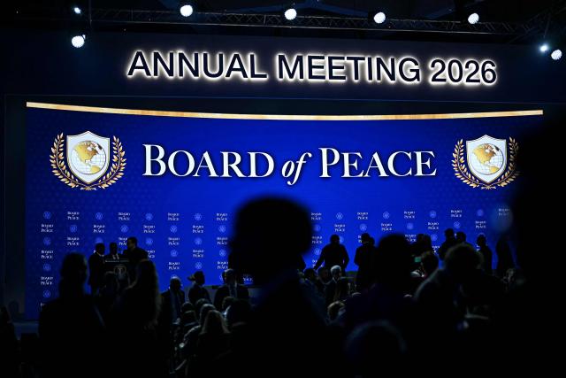 Visitors gather ahead of the Board of Peace meeting during the World Economic Forum (WEF) annual meeting in Davos on January 22, 2026. The World Economic Forum takes place in Davos from January 19 to January 23, 2026. (Photo by Fabrice COFFRINI / AFP)