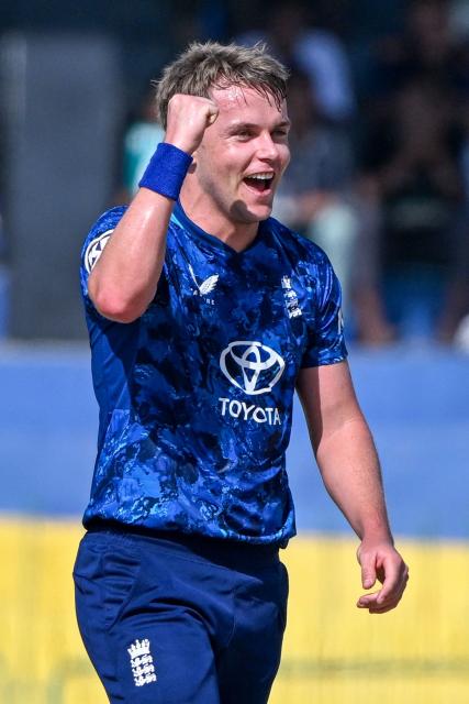England's Sam Curran celebrates after taking the wicket of Sri Lanka's Pathum Nissanka during the first one-day international (ODI) cricket match between Sri Lanka and England at the R. Premadasa International Cricket Stadium in Colombo on January 22, 2026. (Photo by Ishara S. KODIKARA / AFP)