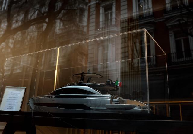 A picture taken on January 21, 2026 shows a model luxury yacht in a store window in Madrid. Madrid has emerged as a coveted global luxury housing destination as Latin American and US investors fuel a real estate boom, seduced by competitive prices and high living standards. (Photo by OSCAR DEL POZO / AFP)
