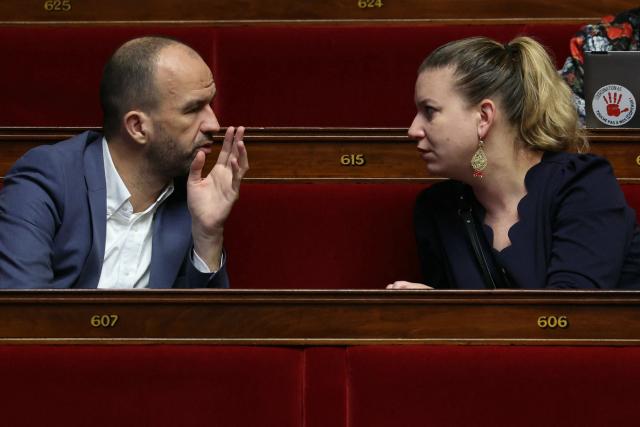 La France Insoumise - Nouveau Front Populaire's MP Manuel Bompard, President of La France Insoumise - Nouveau Front Populaire parliamentary group Mathilde Panot chat during a debate on the examination of draft legislation proposed by Les Républicains (LR) group, which sets the agenda  during their parliamentary niche at the National Assembly in Paris, on January 22, 2026. (Photo by Thomas SAMSON / AFP)